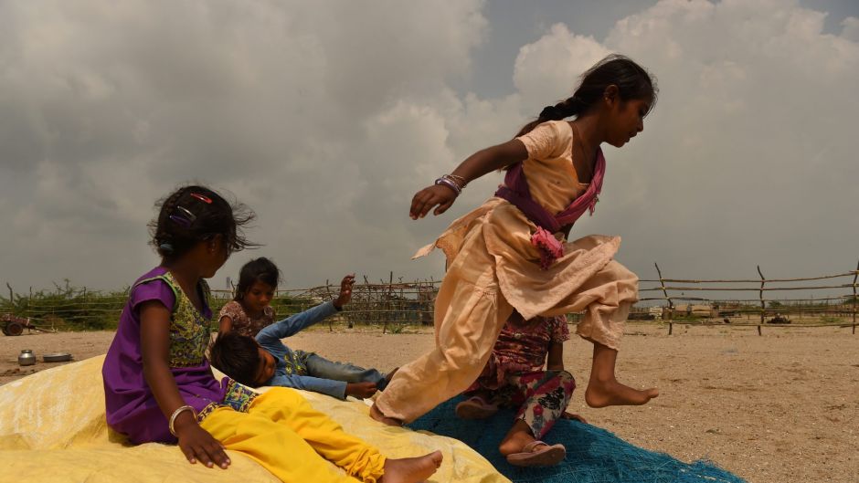 A group of children play in Tragadi Bandar, a fishing settlement on the Kutch coast, in western India. The settlement is ...