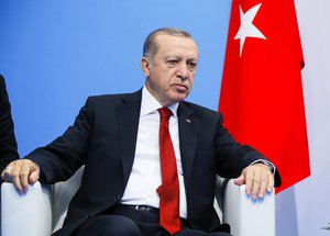 Turkish President Recep Tayyip Erdogan listens to Russian President Vladimir Putin during their talks at the G-20 summit in Hamburg, northern Germany, Saturday, July 8, 2017.