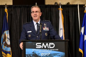 File - Air Force Gen. John E. Hyten, commander of U.S. Strategic Command, speaks at the 20th annual Space and Missile Defense Symposium on "Enabling Decisive Action in a Multi-Domain Environment" at the Von Braun Center in Huntsville, Alabama, Aug. 8, 2017.