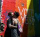 CROPPED FROM ORIGINAL SMH NEWS. SEXPOL?: A couple embraces to celebrate the yes verdict of Australia?s postal vote on ...