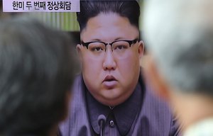 People watch a TV screen showing an image of North Korean leader Kim Jong Un delivers a statement in response to U.S. President Donald Trump's speech to the United Nations, in Pyongyang, North Korea, at Seoul Railway Station in Seoul, South Korea, Friday, Sept. 22, 2017.