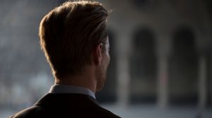 Back view of a young Caucasian businessman.