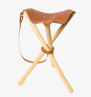 This classic tripod stool folds down.