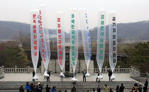 FILE - In this April 15, 2011 file photo, Park Sang Hak, center, a refugee from the North who now runs the group Fighters for a Free North Korea from a small Seoul office