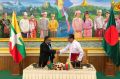 Myanmar's Union Minister Kyaw Tint Swe, right, shakes hands with Bangladeshi Foreign Minister Abdul Hassan Mahmud Ali ...