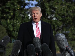 President Donald Trump speaks to reporters before leaving the White House, Tuesday, Nov. 21, 2017, in Washington for a Thanksgiving trip to Mar-a-Lago estate in Palm Beach, Fla.