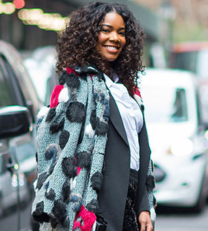 City chic: Gabrielle Union put on a very glamorous display in sequin trousers and a fluffy cape as she stepped out in NYC