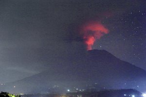 A view of the Mount Agung volcano erupting, in Karangasem, Bali island, Indonesia, early Sunday, Nov. 26, 2017