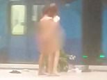 Two men were caught on camera appearing to have sex on the platform of a busy train station platform in Melbourne