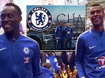 Michael Essien (left) and Ashley Cole marched the Premier League trophy through New York