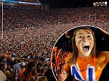 Auburn Tigers fans storm the field in celebration after the victory over the Alabama Crimson Tide at Jordan Hare Stadium