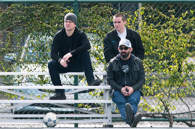 In the crowd: The 46-year-old actor sat in the stands and watched the game with friends