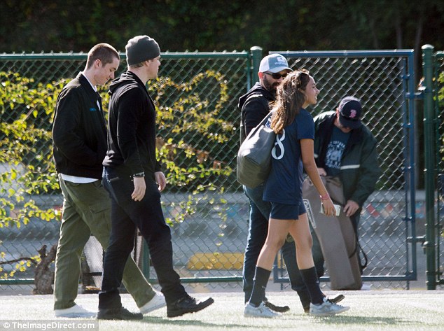 Nice match: The Academy Awards winner walked away with his daughter and friends after the game