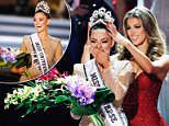 New Miss Universe Demi-Leigh Nel-Peters (left) is crowned by her predecessor Iris Mittenaere of France on Sunday