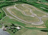 Banking heir and racing enthusiast Alan Wilzing turned the backyard of his 150-year-old Dutch Colonial-style home in Taghkanic, New York, into a real-life, 1.15-mile-long, 40-foot-wide Formula One racetrack (pictured)