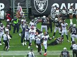 Denver Broncos cornerback Aqib Talib (21) fights Oakland Raiders wide receiver Michael Crabtree (15) during the first half of an NFL football game in Oakland, California on Sunday, November 26