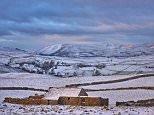 A winter vista looking across the upper Eden Valley as morning breaks with the first rays of sunlight clipping the snow covered Howgill Fells in Cumbria today. Commuters should expect milder temperatures than what we have experienced over this weekend on Monday, with parts of Southern England expected to reach double digit temperatures during the day