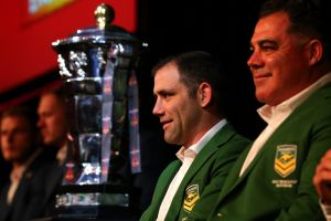 World at his feet: Kangaroos skipper Cameron Smith and coach Mal meninga with the World Cup trophy on Wednesday.