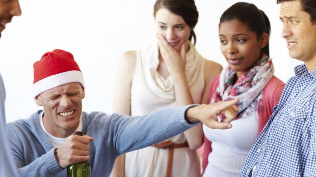 A male employee having too much fun at the office party while his colleagues look on  Christmas party, office christmas ...