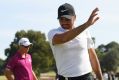 'It is what it is': Jason Day acknowledges the crowd as he walks off the 18th green to end a frustrating round.