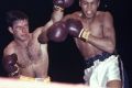 "Hard as nails": Tony Madigan fighting Cassius Clay, later Muhammad Ali, in 1959.