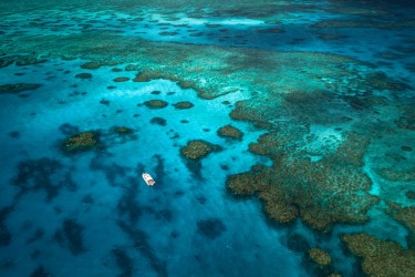 Waiting for the clouds to clear in-between dives on Rib Reef, an azure oasis off Orpheus Island in North Queensland. ...