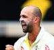 Hard to tame: Nathan Lyon celebrates after dismissing Dawid Malan for just four runs in the second innings at the Gabba.