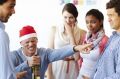 A male employee having too much fun at the office party while his colleagues look on  Christmas party, office christmas ...