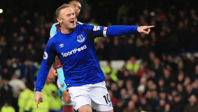 Out of danger, for now: Wayne Rooney celebrates one of his three goals.