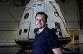 Tesla CEO Elon Musk with the SpaceX Dragon capsule.