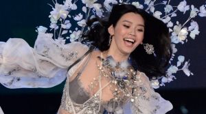 Ming Xi loses her balance on the catwalk for the Victoria's Secret Fashion Show.