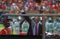 Kenyan President Uhuru Kenyatta waves from behind bulletproof glass as he arrives for his inauguration ceremony on Tuesday.