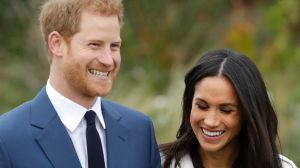 Britain's Prince Harry and his fiancee Meghan Markle pose for photographers during a photocall in the grounds of ...