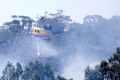 A helicopter helps the effort to control a fire in Sunbury on Christmas Day.