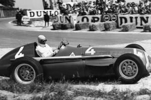 Juan Manuel Fangio comes out of a bend at speed in July, 1951.