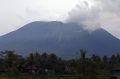 Mount Agung spews volcanic ash into the air at Selat village.