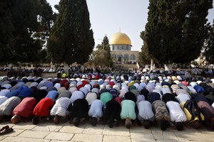 alestinians pray inside the Al Aqsa Mosque compound in Jerusalem's Old City Thursday, July 27, 2017