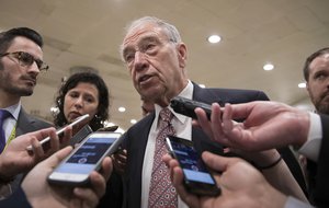 With the deadline looming to pass a spending bill to fund the government by week's end, Senate Judiciary Committee Chairman Chuck Grassley, R-Iowa, and other senators gather for weekly strategy meetings on Capitol Hill in Washington, Tuesday, Dec. 5, 2017.