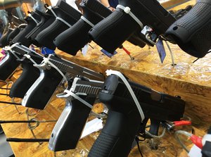 Glock guns in 2 rows on display at a gun show. Taken on July 2017.