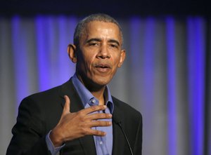 Former President Barack Obama address the participants at a summit on climate change involving mayors from around the globe Tuesday, Dec. 5, 2017, in Chicago.