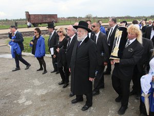 Jews from Israel and other countries march in silence between the two parts of Auschwitz-Birkenau Nazi German death camp in an annual 'March of the Living' in Oswiecim, Poland, on Monday, April 28, 2014, in memory of some 6 million Jews killed during the Holocaust.