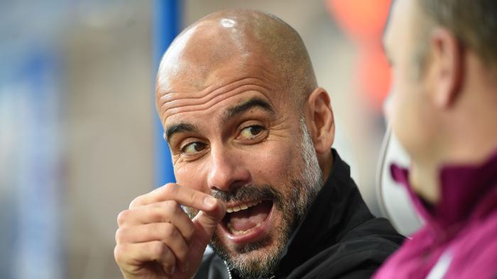 Manchester City's Spanish manager Pep Guardiola speaks with Manchester City's Spanish assistant coach Rodolfo Borrell before kick off in the English Premier League football match between Huddersfield Town and Manchester City at the John Smith's stadium in Huddersfield, northern England on November 26, 2017. / AFP PHOTO / Oli SCARFF / RESTRICTED TO EDITORIAL USE. No use with unauthorized audio, video, data, fixture lists, club/league logos or 'live' services. Online in-match use limited to 75 images, no video emulation. No use in betting, games or single club/league/player publications. /