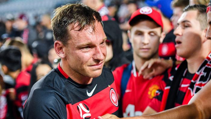 A crying Brendon Santalab of the Wanderers is consoled by Wanderers fans after the 5-0 defeat by Sydney FC during the round 10 A-League match between Western Sydney Wanderers FC and Sydney FC at ANZ Stadium in Sydney, Saturday, December 9, 2017. (AAP Image/Brendan Esposito) NO ARCHIVING, EDITORIAL USE ONLY