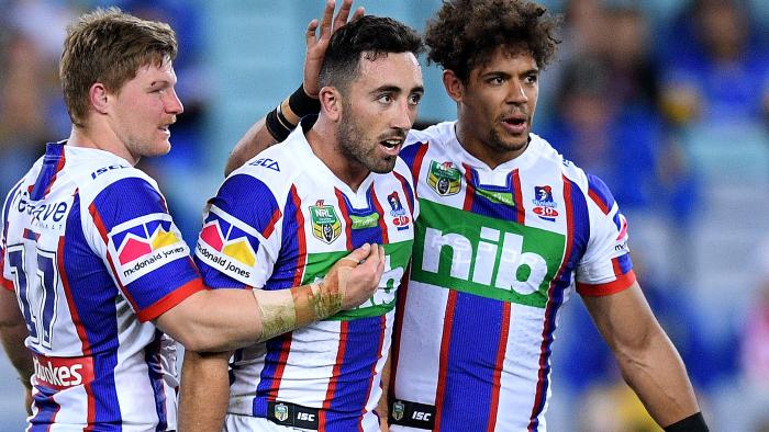 Brock Lamb of the Knights, (centre), is congratulated by Luke Yates, (left), and Dane Gagai after kicking a field goal during the Round 23 NRL match between the Parramatta Eels and the Newcastle Knights at ANZ Stadium in Sydney, Friday, August 11, 2017. (AAP Image/Dan Himbrechts) NO ARCHIVING, EDITORIAL USE ONLY