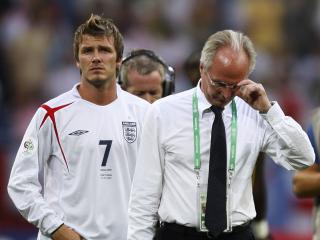 English midfielder David Beckham (L) and Swedish head coach of the English team Sven-Goran Eriksson look dejected at the end of the World Cup 2006 quarter final football game England vs. Portugal, 01 July 2006 at Gelsenkirchen stadium. Portugal won 3-1 on penalties. AFP PHOTO / ARIS MESSINIS