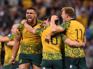 Lukhan Tui of the Wallabies (left) reacts following Australia's win in the Rugby Championship, Bledisloe Cup match between the Australian Wallabies and the New Zealand All Blacks at Suncorp Stadium in Brisbane, Saturday, October 21, 2017. (AAP Image/Dave Hunt) NO ARCHIVING