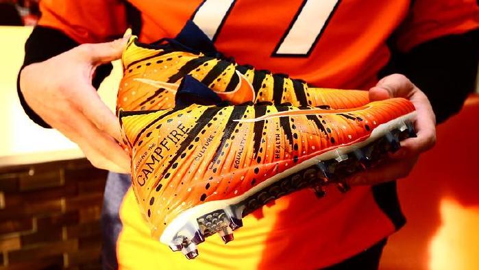 Australian NFL player Adam Gotsis wearing Indigenous designed boots