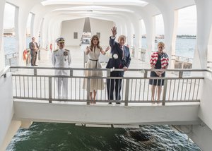 U.S. Pacific Command (USPACOM) Commander, Adm. Harry Harris observes First Lady Melania Trump and President Donald J. Trump as they offer flowers in honor of fallen service members at the USS Arizona Memorial in Hawaii, US,  Nov. 3, 2017.