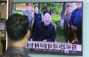 A man watches a TV news program showing image of North Korean leader Kim Jong Un, published in the North Korea's Rodong Sinmun newspaper, at Seoul Railway station  in Seoul, South Korea, Monday, May 22, 2017.