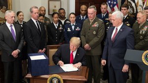 President Donald J. Trump, joined by Vice President Mike Pence and senior military leaders, signs H.R. 2810, the National Defense Authorization Act for fiscal year 2018, in the Roosevelt Room at the White House, Dec. 12, 2017.